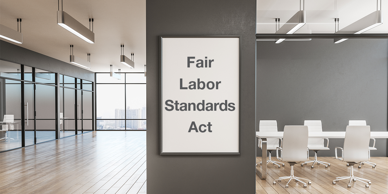 office space with a white poster on the wall with the words Fair Labor Standards Act written on it